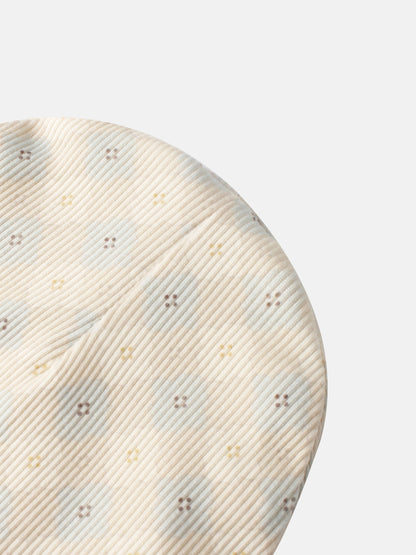 Little Button Blue layette set for boys, beige striped fabric close-up