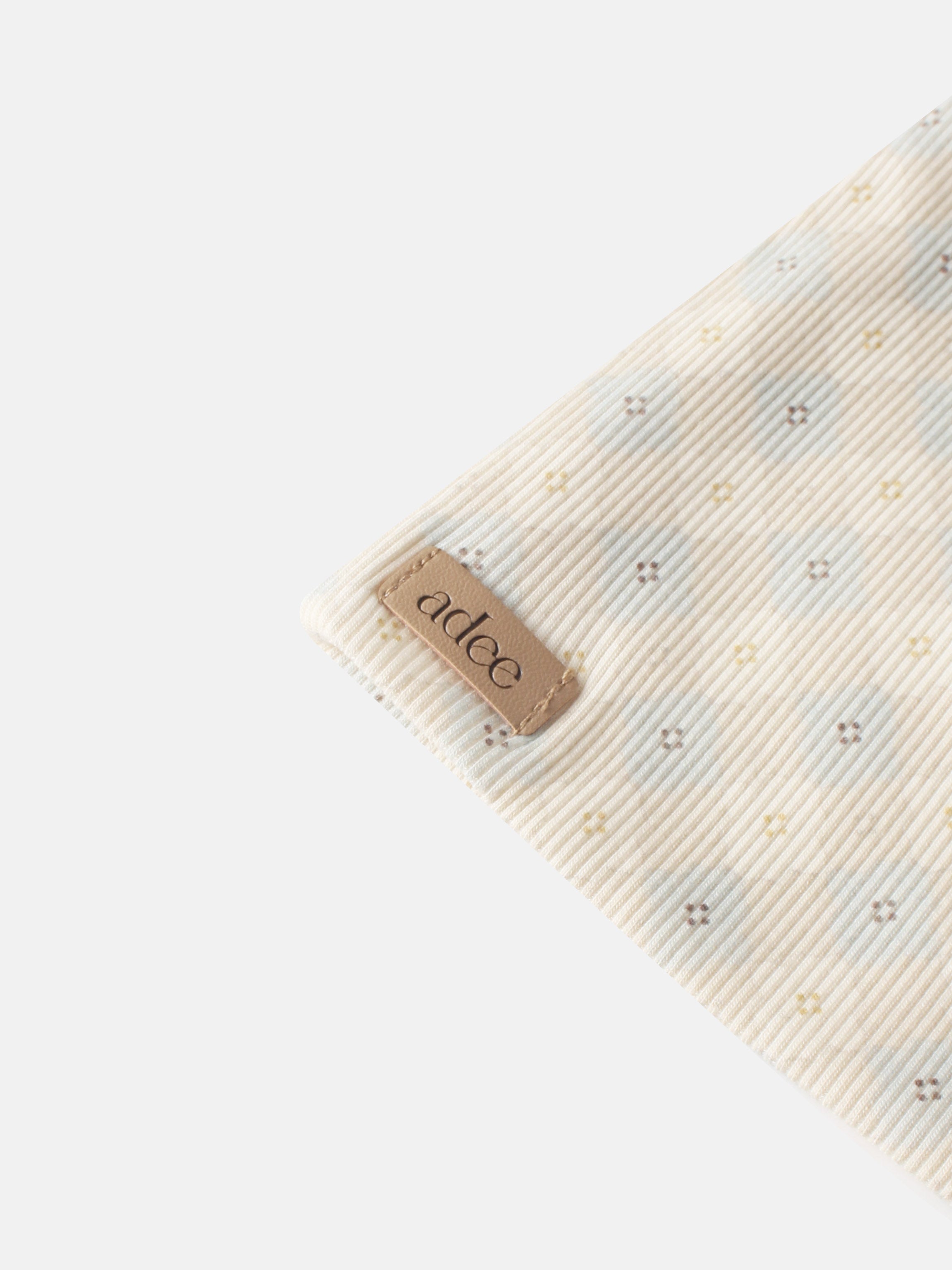 Little Button Beanie Blue for boys by Adee; striped fabric with tiny cross-stitch motifs and a leather patch