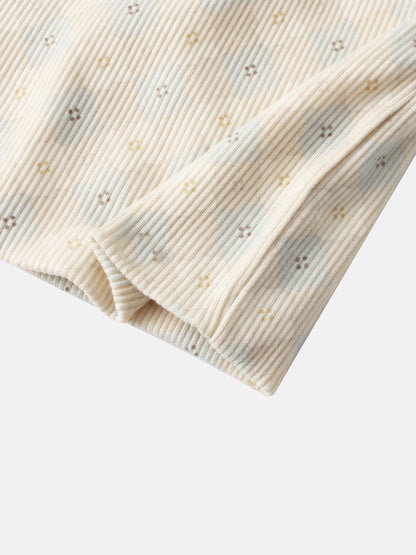 Little Button Beanie for boys in cream rib-knit fabric with tiny yellow and brown floral dots