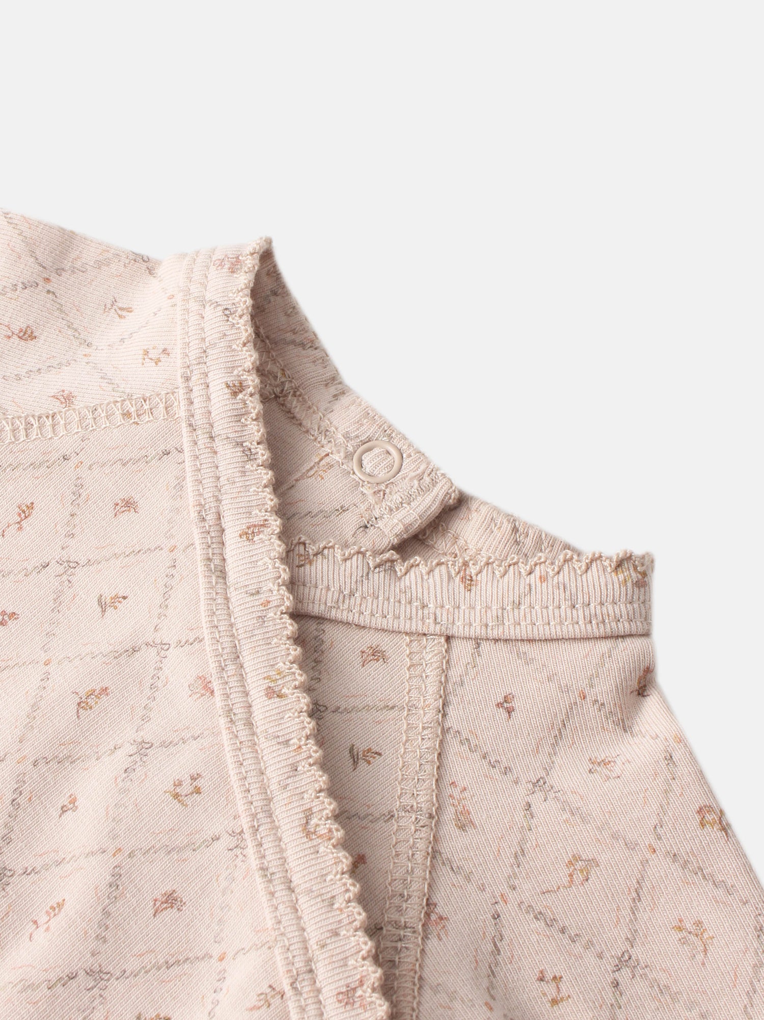 Dainty Diamond Stretchy girls top in pale pink with frayed edges and diamond pattern