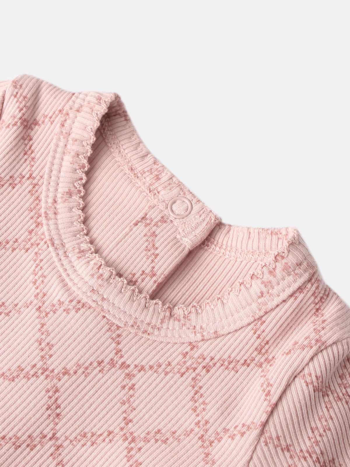 Pink Leaf Stretchy girls knit top by Adee; ribbed fabric, scalloped neckline trim, shoulder button.