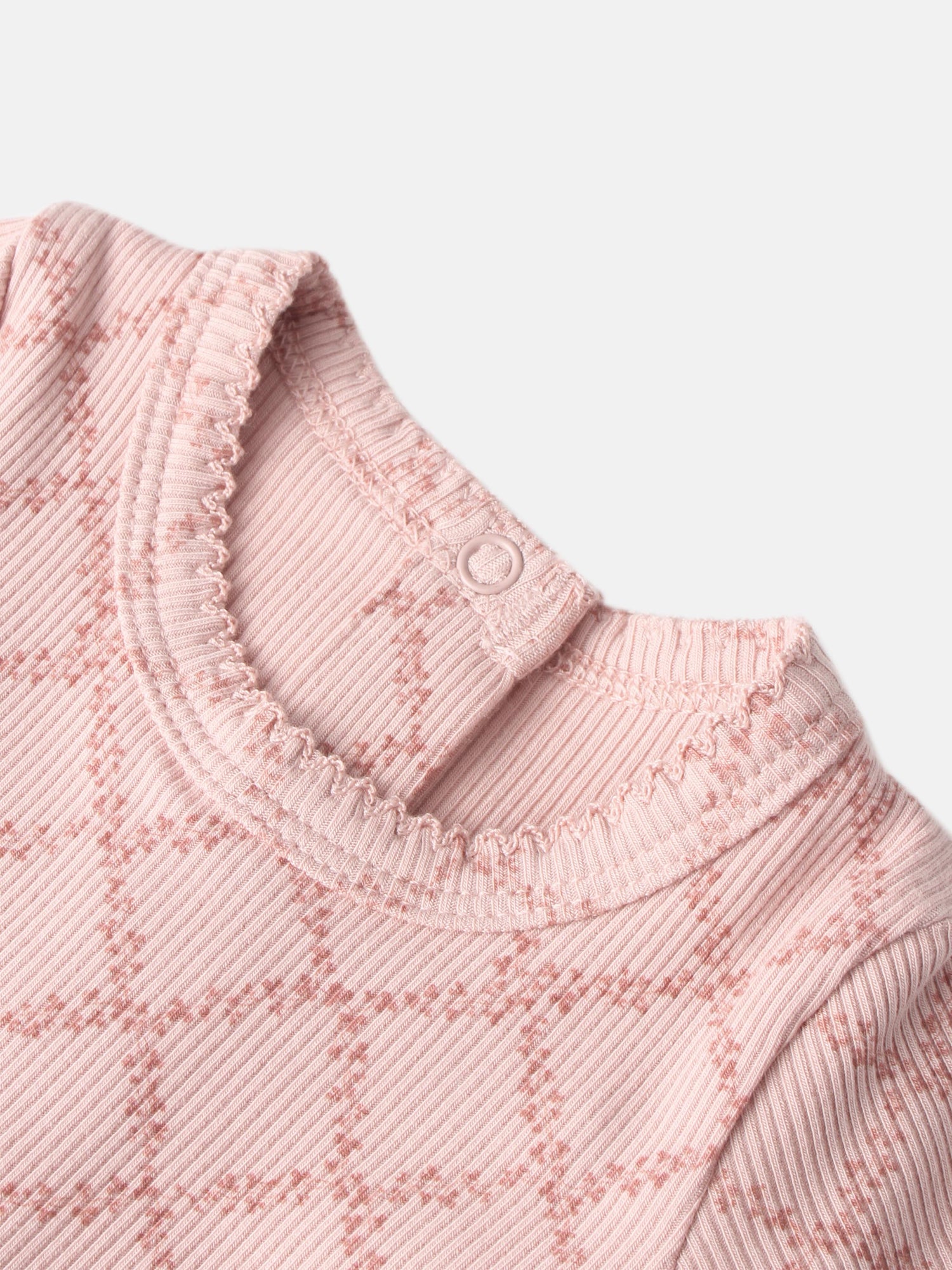 Pink Leaf Stretchy girls knit top by Adee; ribbed fabric, scalloped neckline trim, shoulder button.