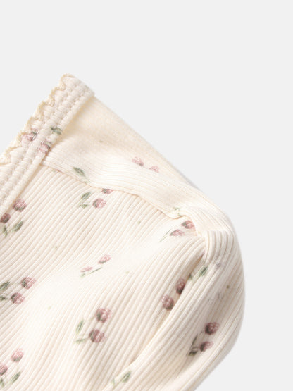 Tiny Tulip Bonnet by Adee; cream girls’ knit bonnet with pink floral print and ribbed edge.