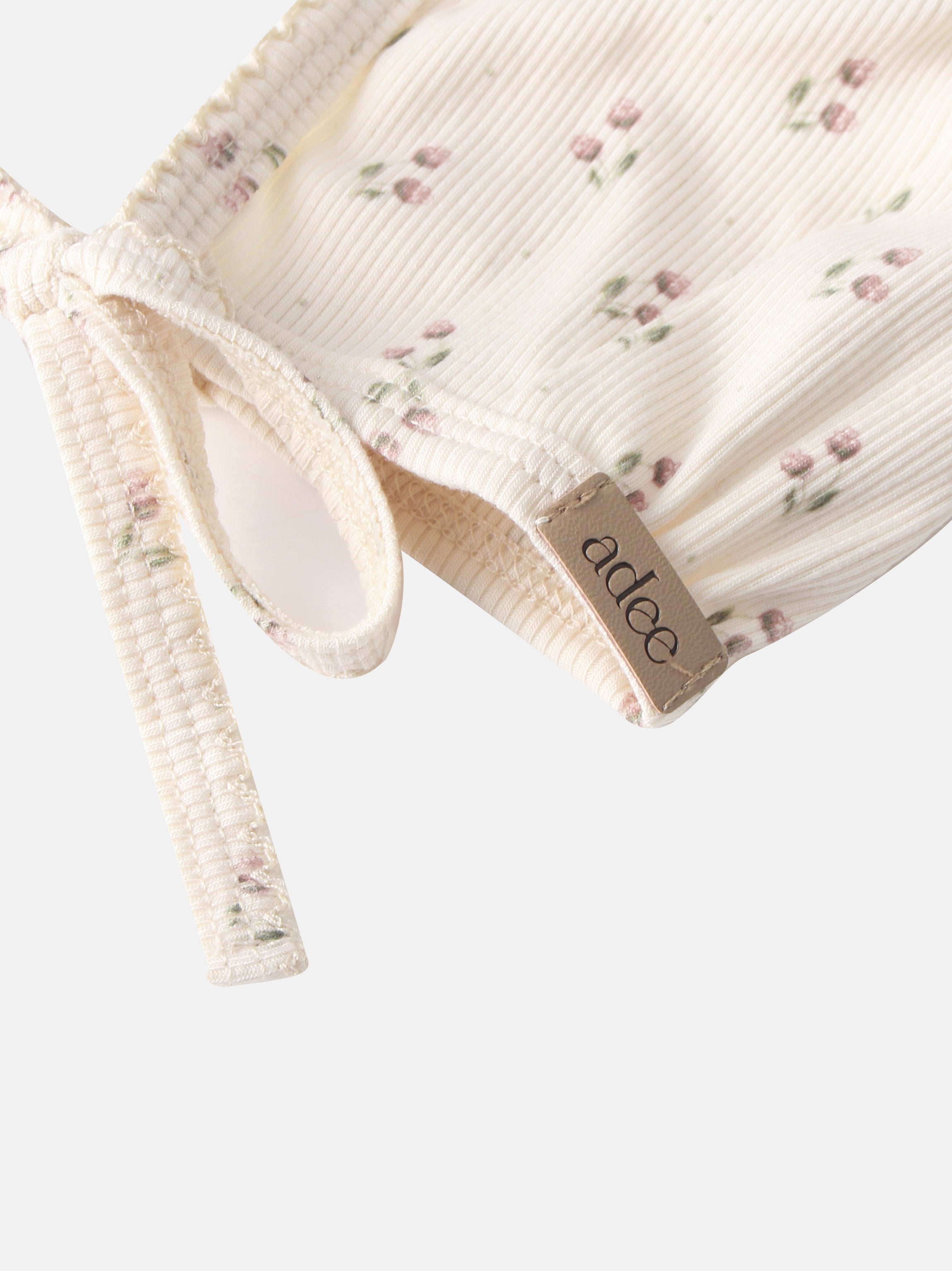 Tiny Tulip Bonnet, cream corduroy with pink floral print for girls by Adee.