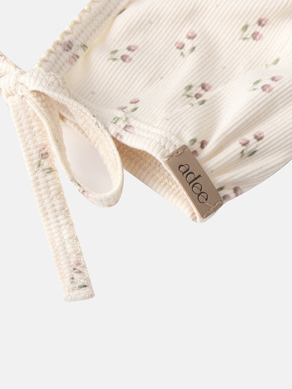 Tiny Tulip Bonnet, cream corduroy with pink floral print for girls by Adee.