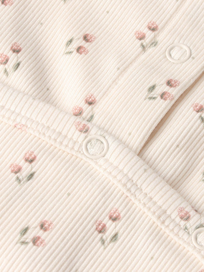 Tiny Tulip layette set by Adee; pale pink ribbed fabric with tiny pink flowers and white snap buttons.