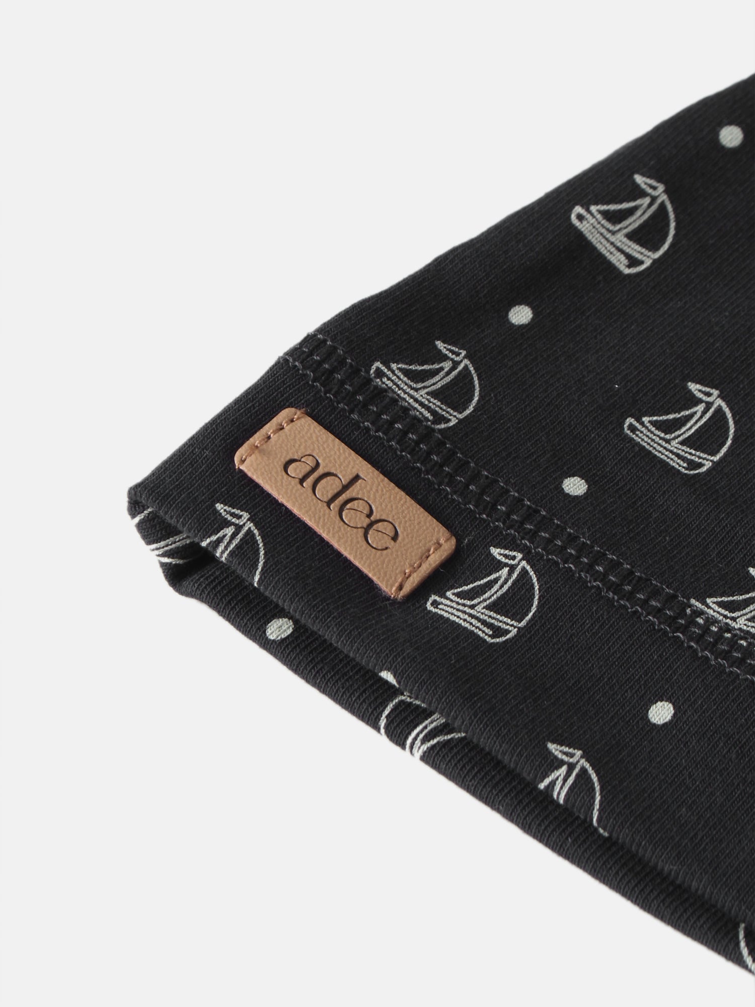 Harbor Dot Layette Set by Adee; black fabric with white anchor and dot pattern, Adee brand tag visible