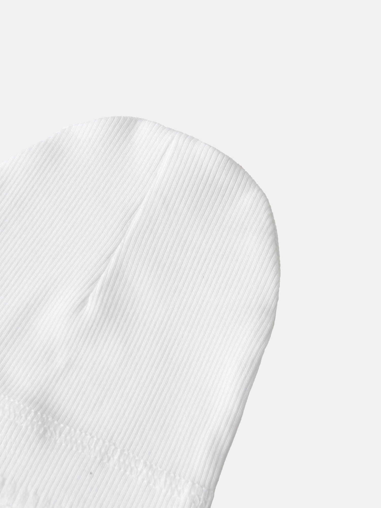 Legacy Stitch White layette set close-up of white ribbed cotton fabric; unisex