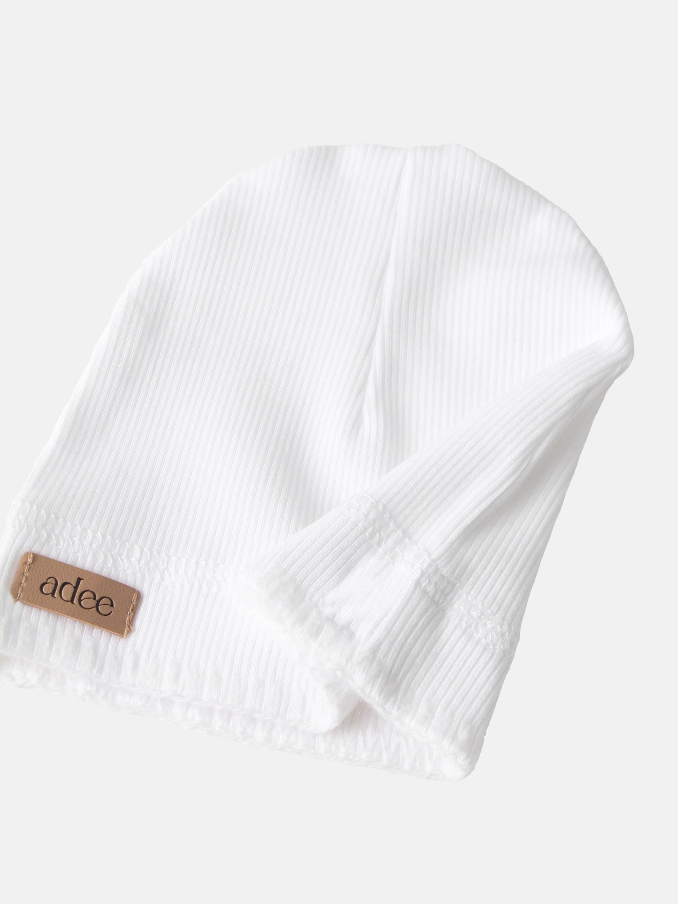Legacy Stitch Hat - White, unisex beanie by Adee with corduroy-textured fabric and leather patch.