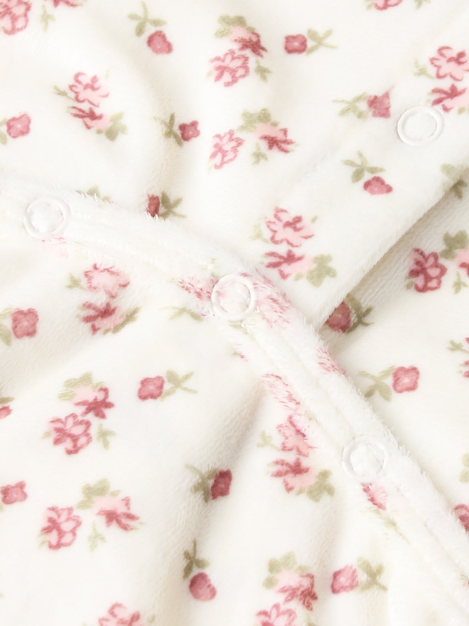 Tiny Blossom layette set by Adee; white fabric with pink floral print and snap buttons.