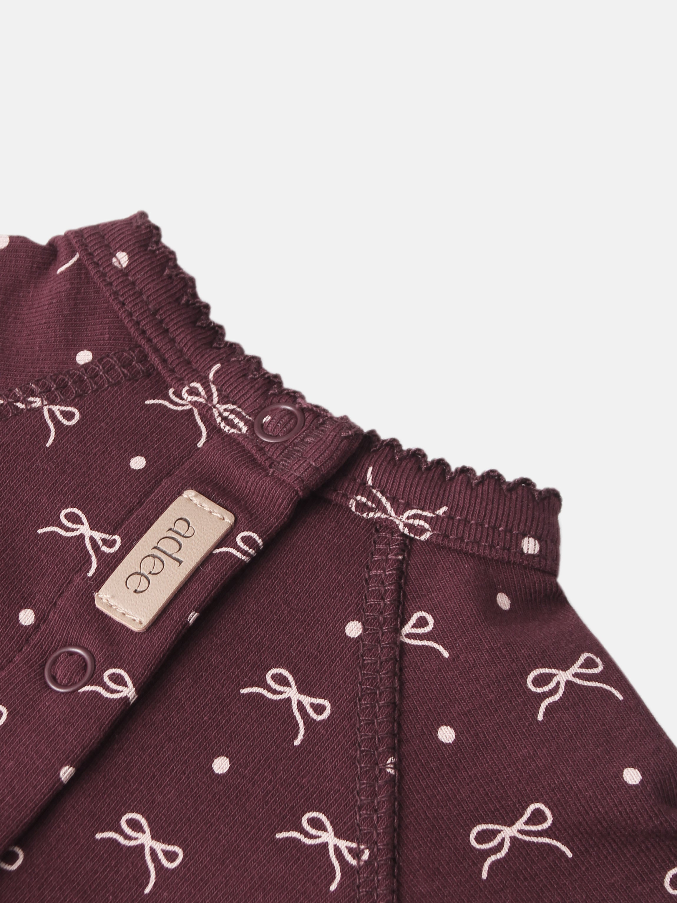 Burgundy Bow Stretchy for girls by Adee; knit fabric with white bow pattern and elastic smocked waist.