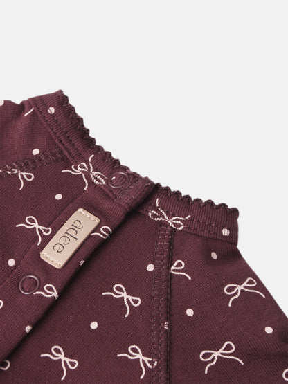 Burgundy Bow Stretchy for girls by Adee; knit fabric with white bow pattern and elastic smocked waist.
