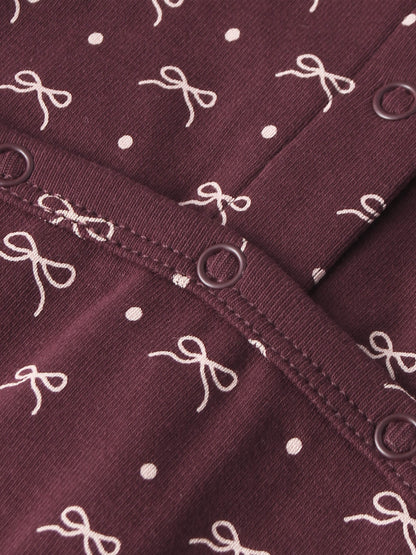 Burgundy Bow Stretchy fabric for girls by Adee with white bow pattern and metal eyelets