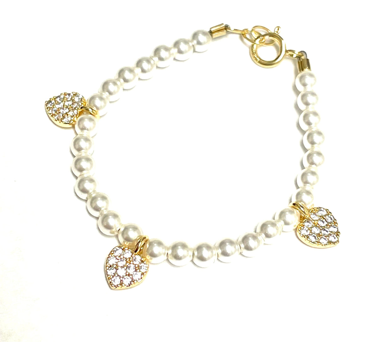 Pearl &amp; Ruby Bracelet - White; white pearl bracelet with three gold-tone crystal-heart charms