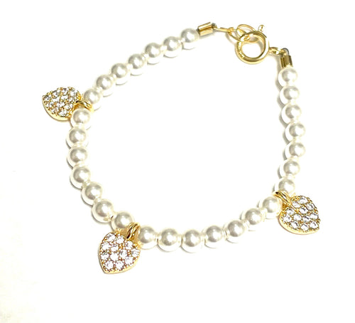 Pearl &amp; Ruby Bracelet - White; white pearl bracelet with three gold-tone crystal-heart charms