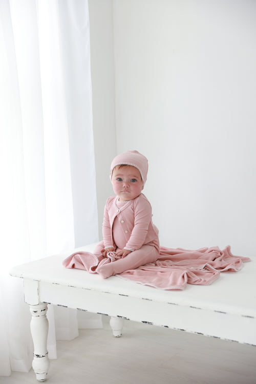 Legacy Stitch Cardigan - Light Pink; Adee dressy girls top worn by baby on a white background.