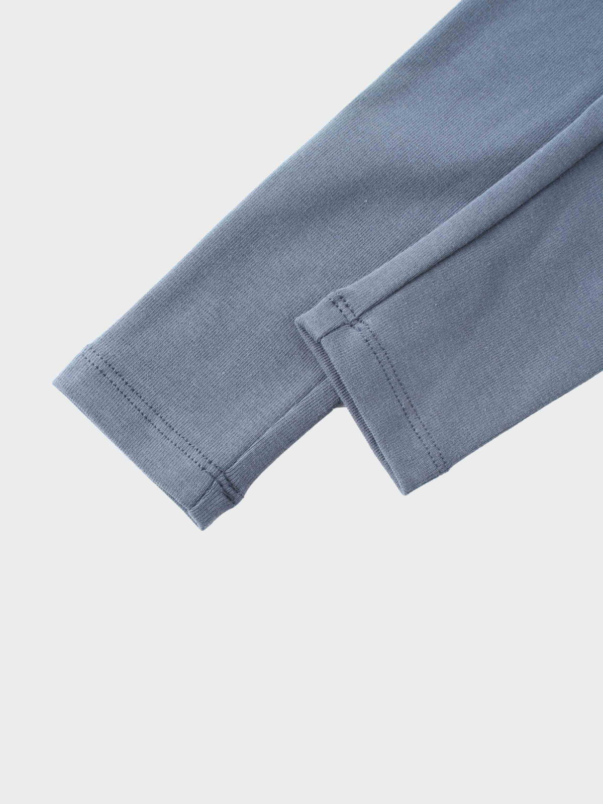 Blue cotton hoodie sleeve with ribbed cuff from baby girl outfit set.
