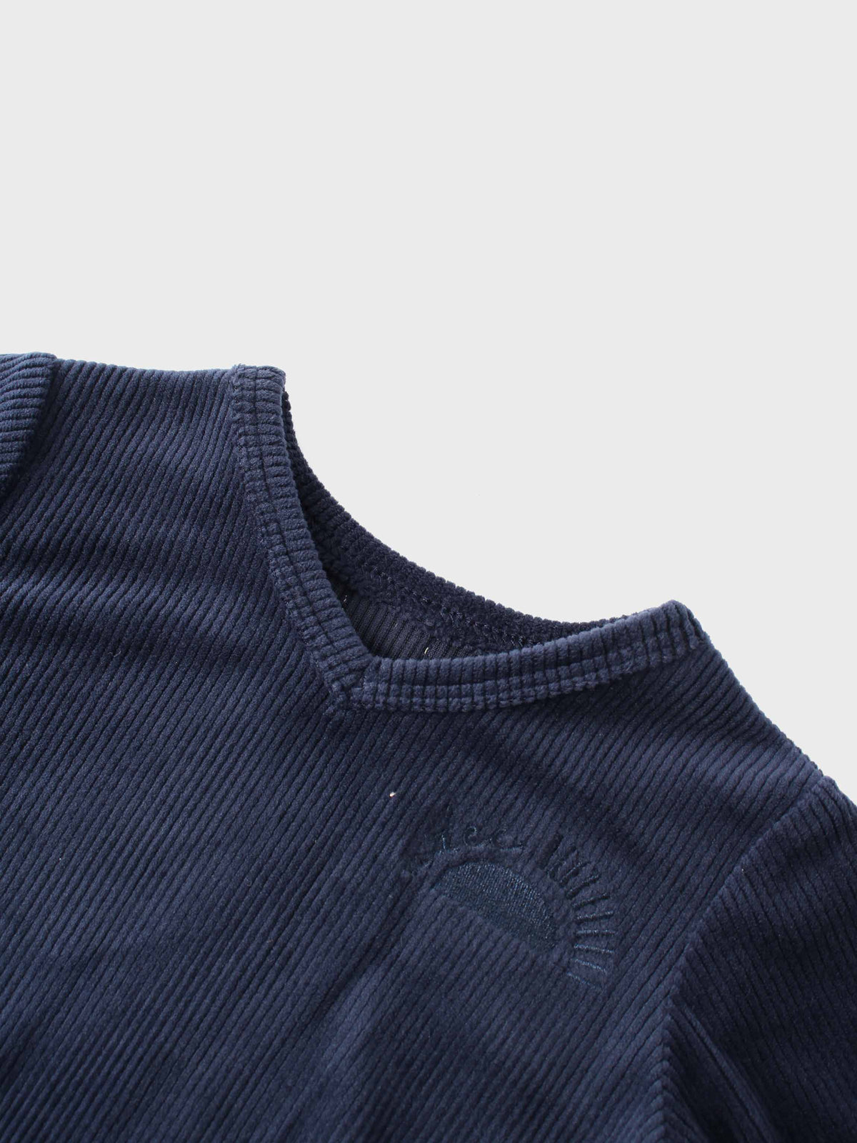 Navy ribbed velour pajama top with V-neck and Adee logo embroidery.