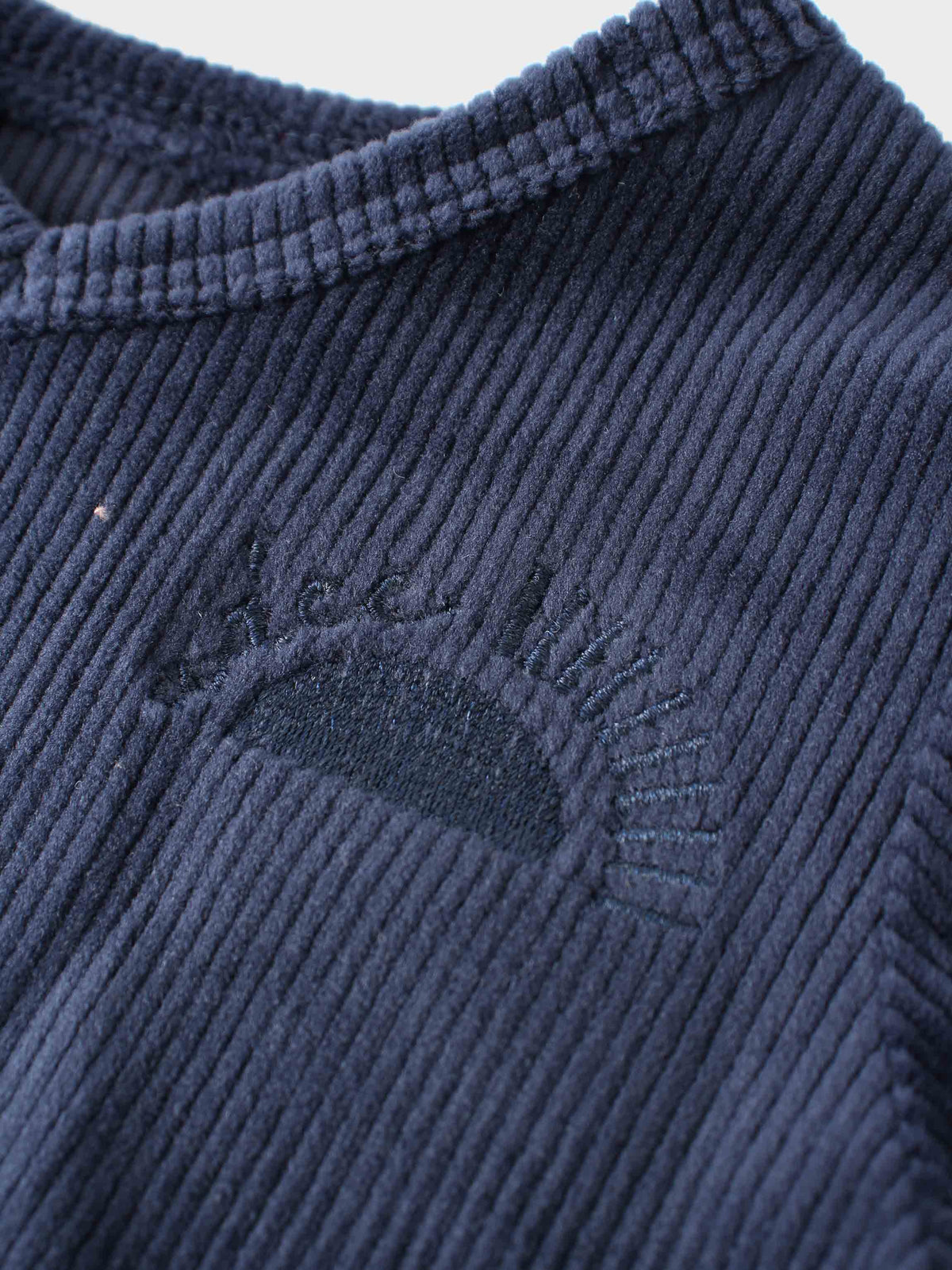Navy ribbed velour pajamas with embroidered Adee logo detail.