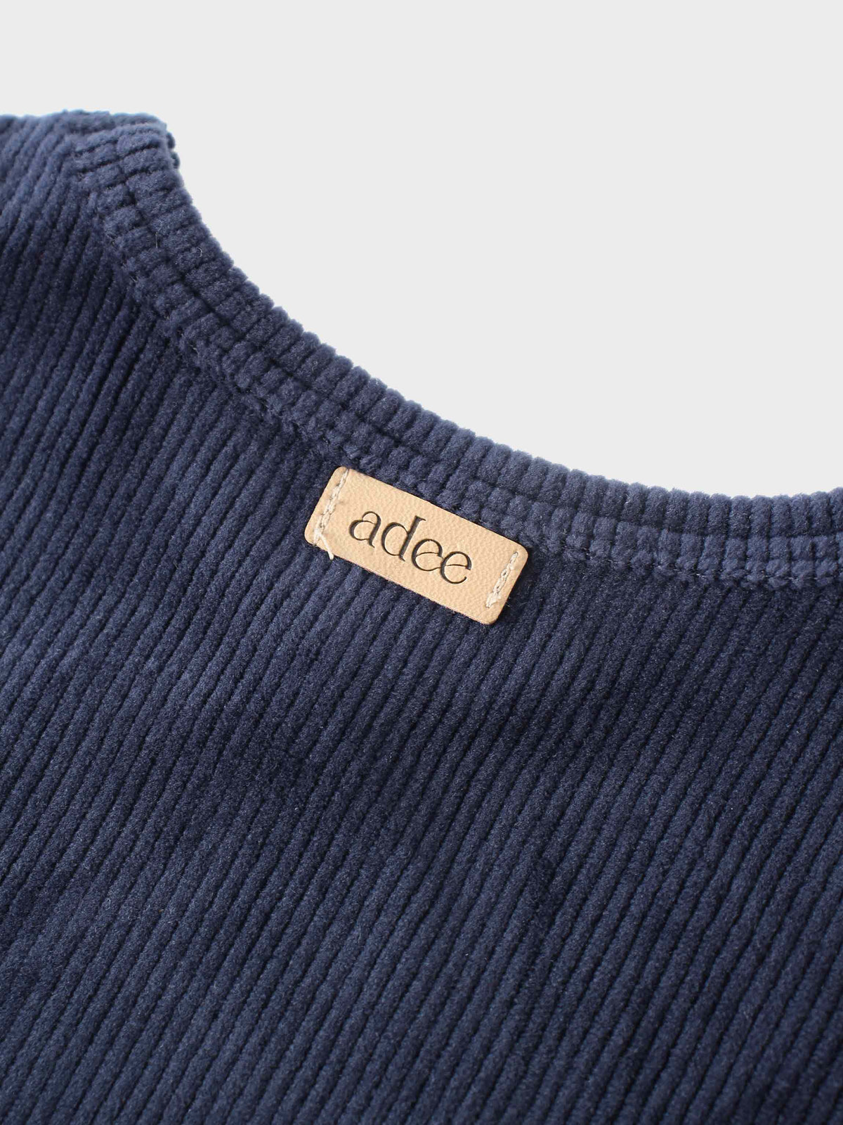 Navy ribbed velour pajamas set for kids with V-neck top and Adee logo tag.