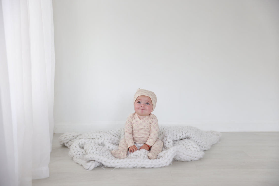 Little Button Stretchy Pink girls stretchies by Adee; soft pink knit fabric on white backdrop.
