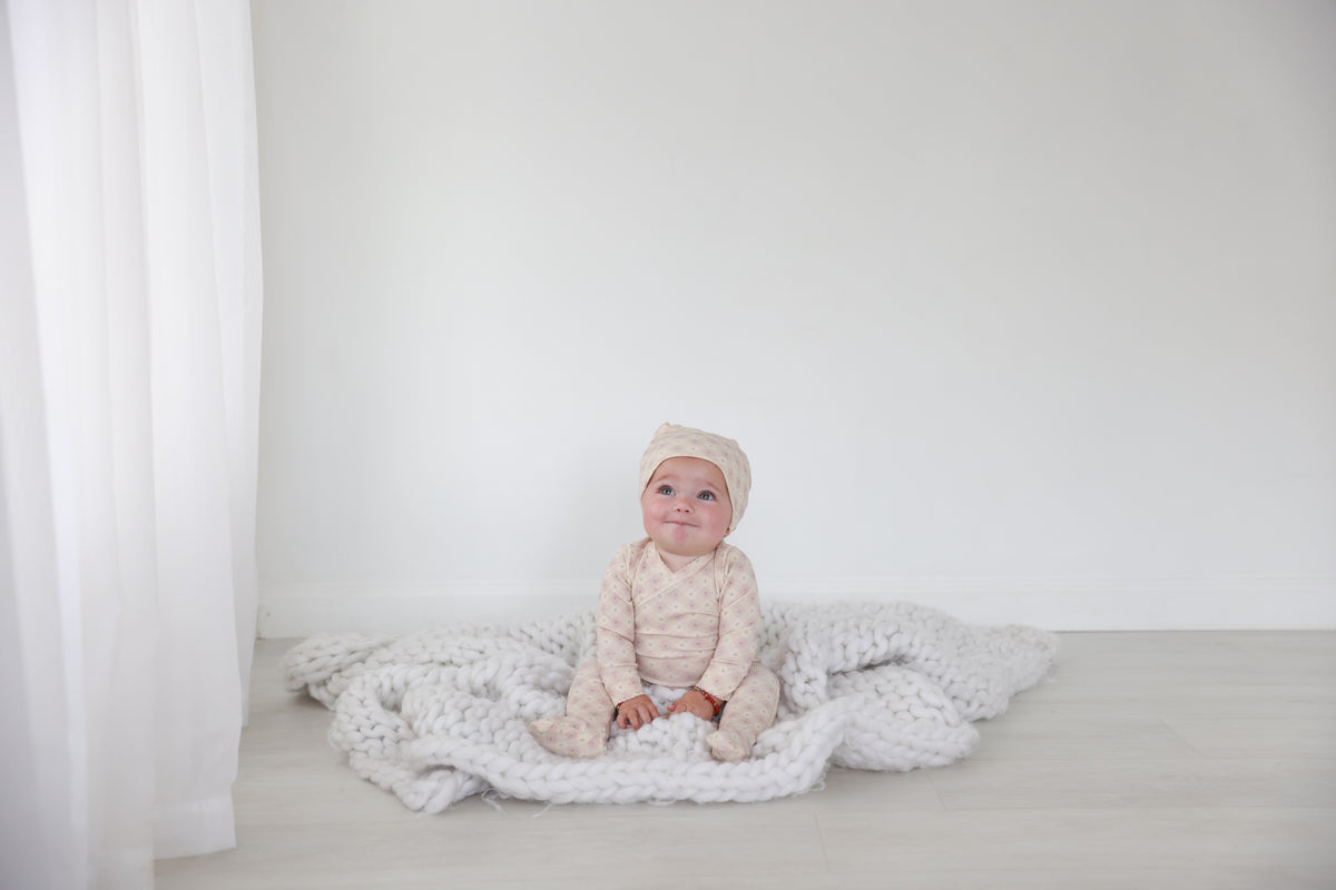 Little Button Stretchy Pink girls stretchies by Adee; soft pink knit fabric on white backdrop.