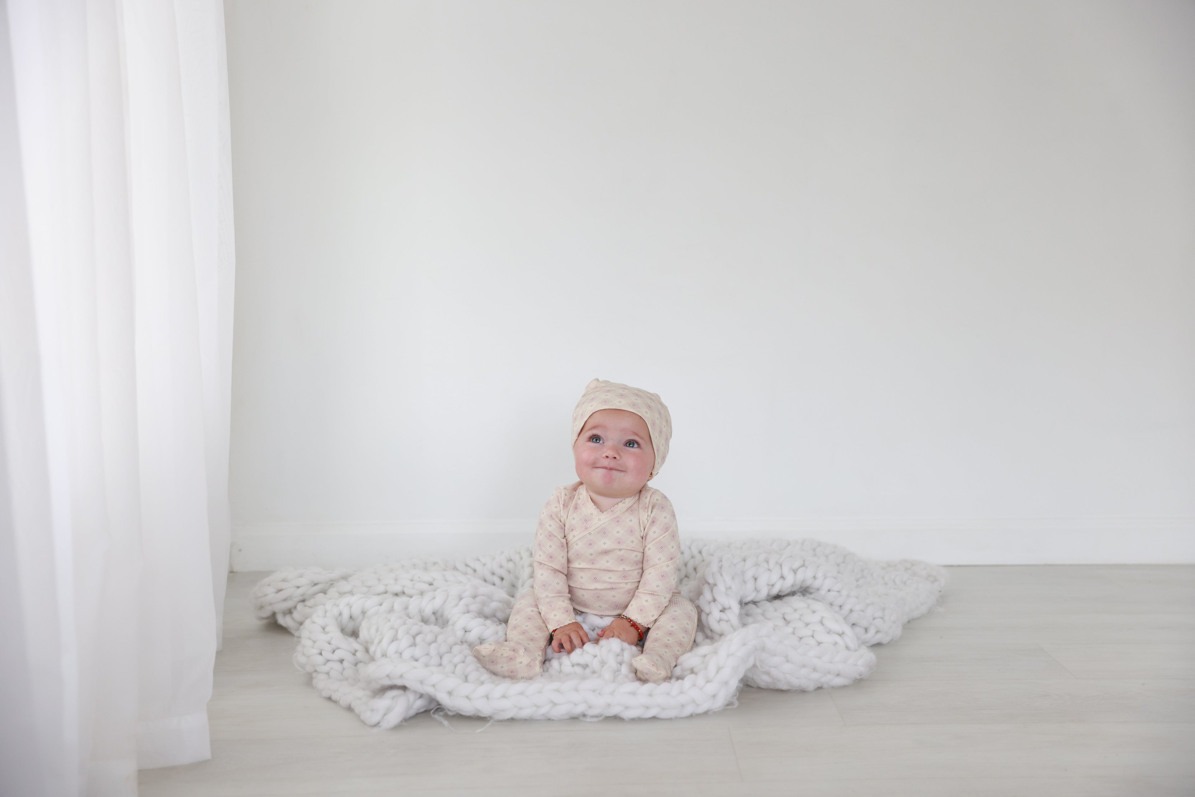 Little Button Stretchy Pink girls stretchies by Adee; soft pink knit fabric on white backdrop.