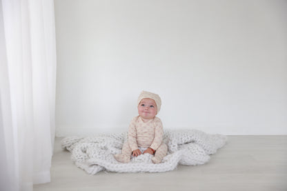 Little Button Stretchy Pink girls stretchies by Adee; soft pink knit fabric on white backdrop.