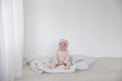 Little Button Stretchy Pink girls stretchies by Adee; soft pink knit fabric on white backdrop.