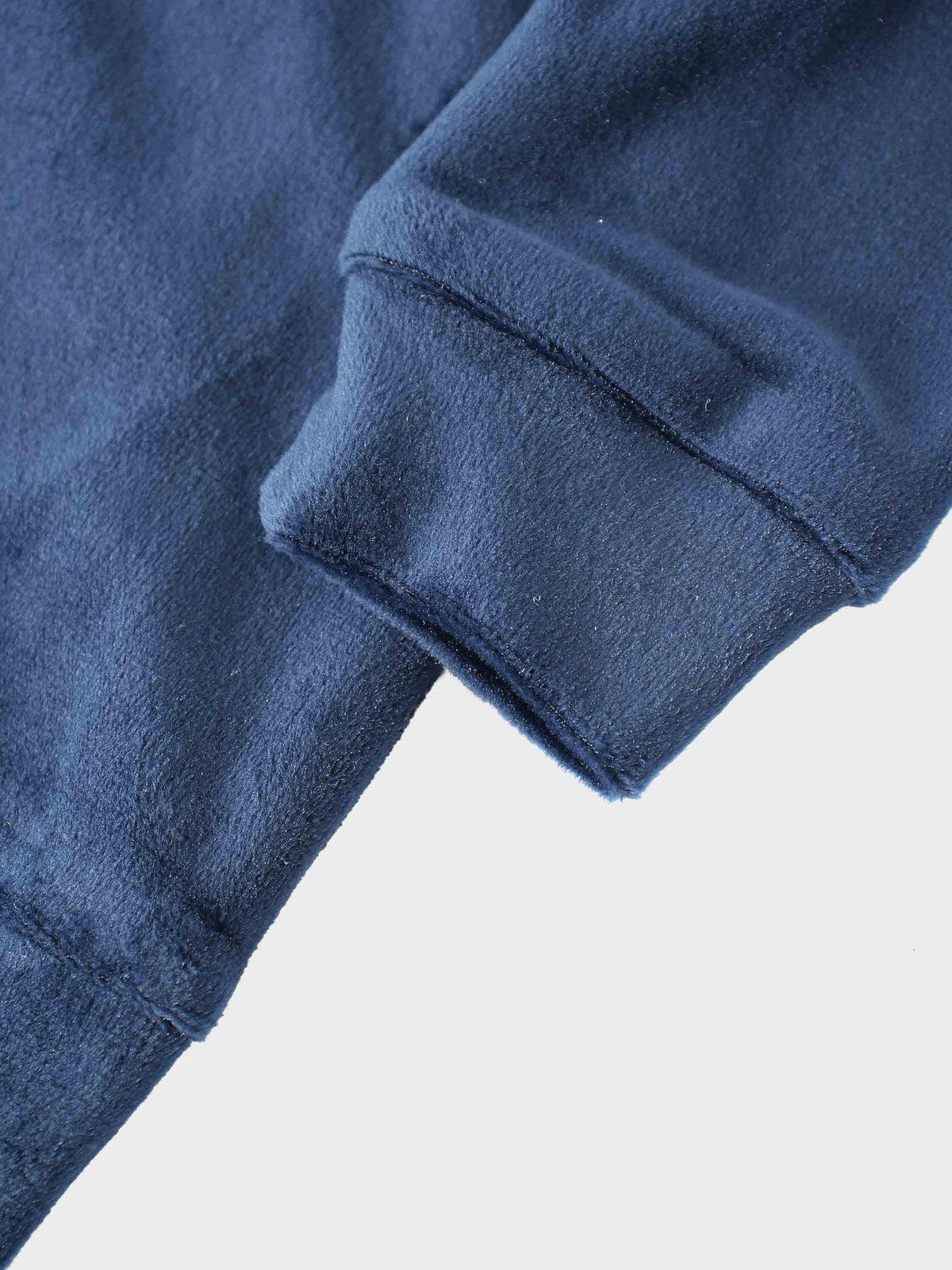 Close-up of navy velour bomber sleeve with cuff from Velour Bomber Set - Navy.