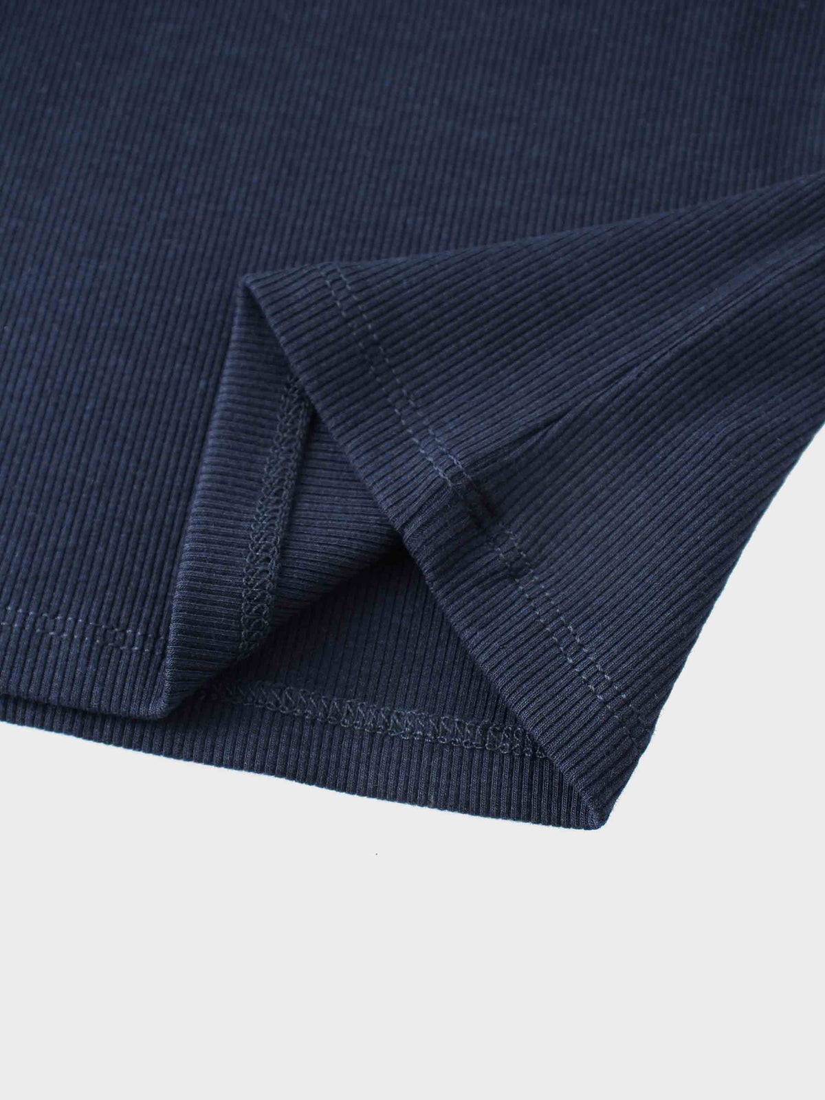 Ribbed legging set navy fabric close-up with folded cuff stitching
