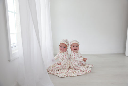 Tiny Blossom Stretchy girls stretchies in floral print, Adee brand, worn by twin babies