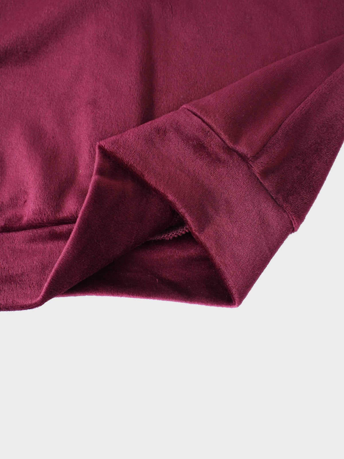 Velour bomber set for girls in burgundy; plush fabric close-up of the sleeve.