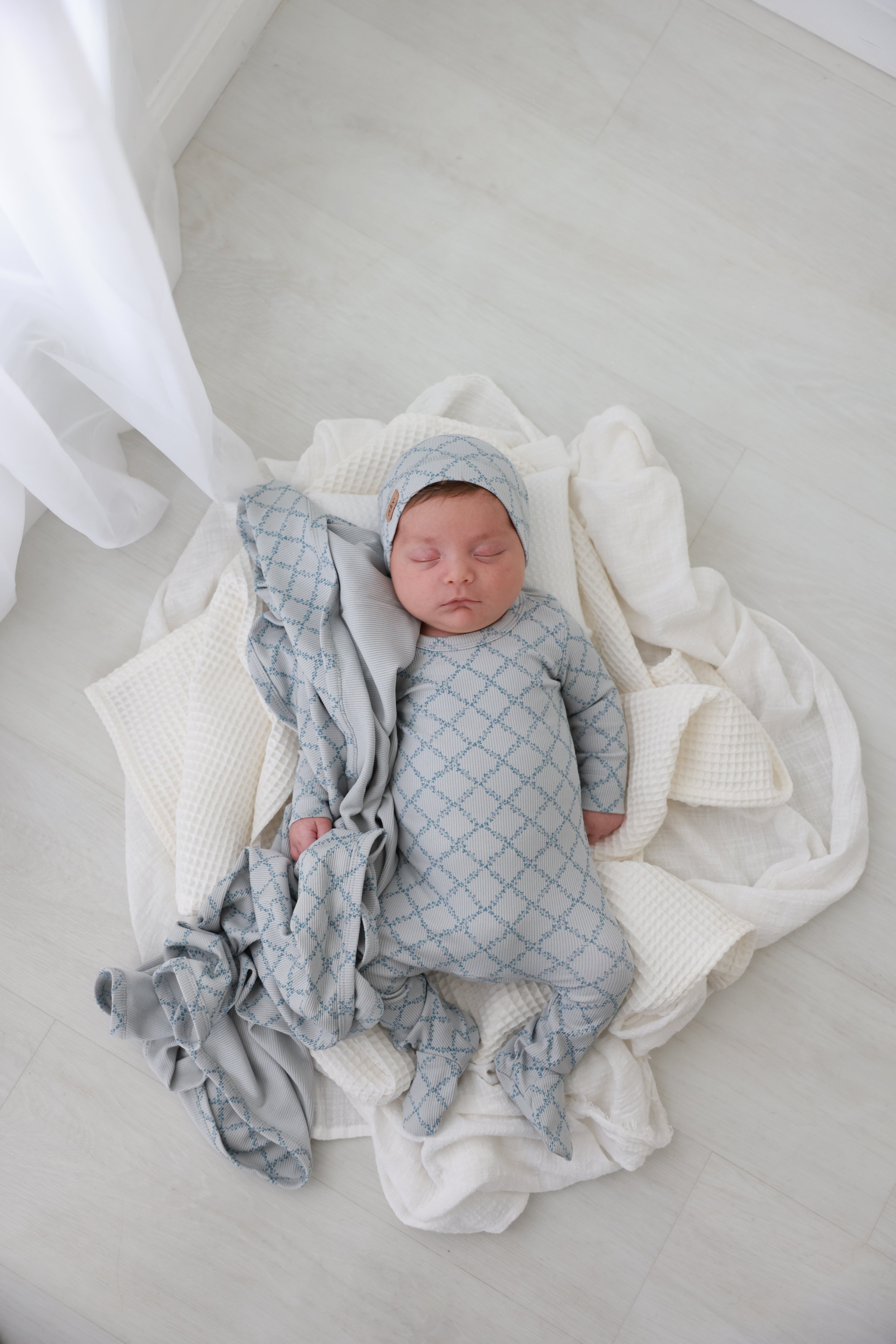 Blue Leaf Stretchy by Adee; boys baby outfit with light-blue geometric leaf pattern.