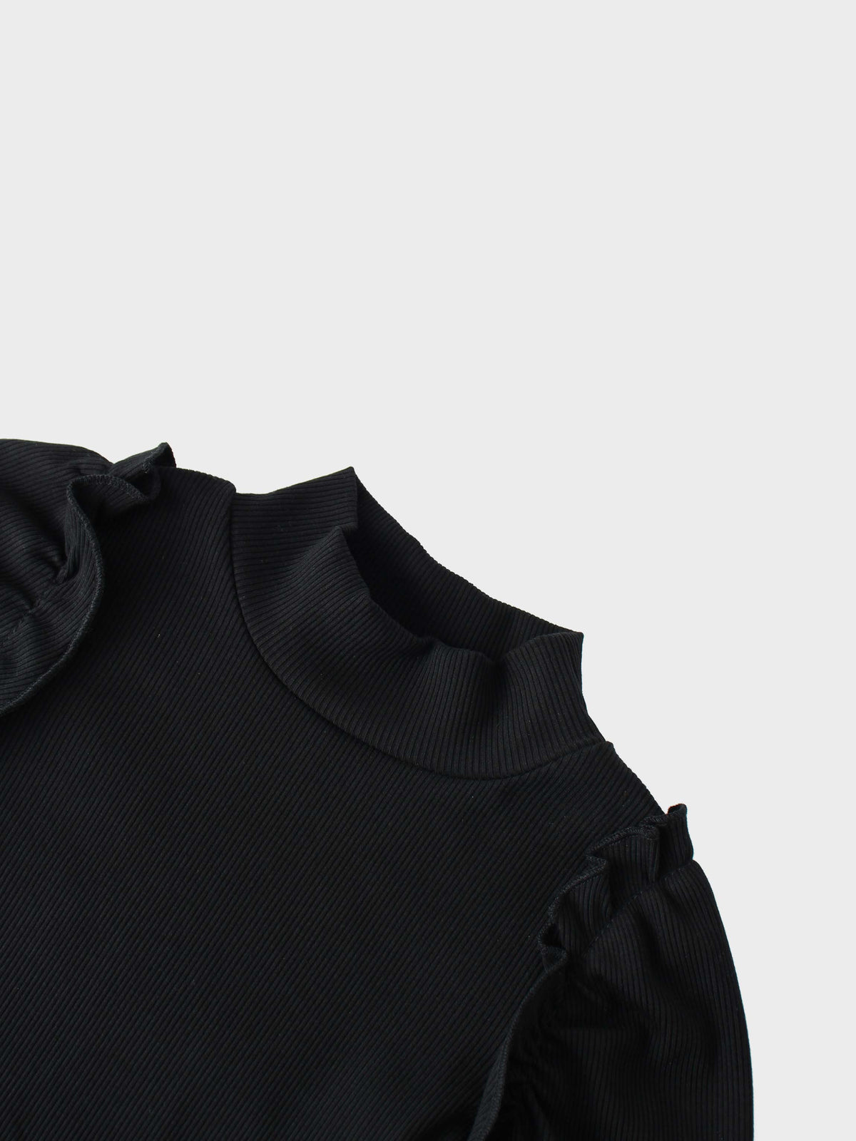 Black ribbed mock-neck shirt with ruffle puff sleeves for girls.