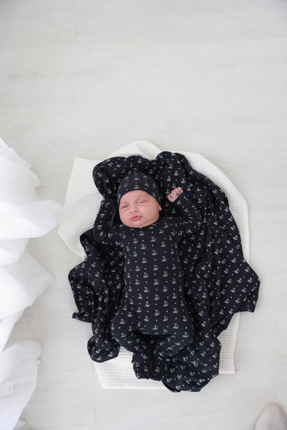 Harbor Dot Layette Set for boys by Adee; navy baby outfit with white sailboats and matching hat.