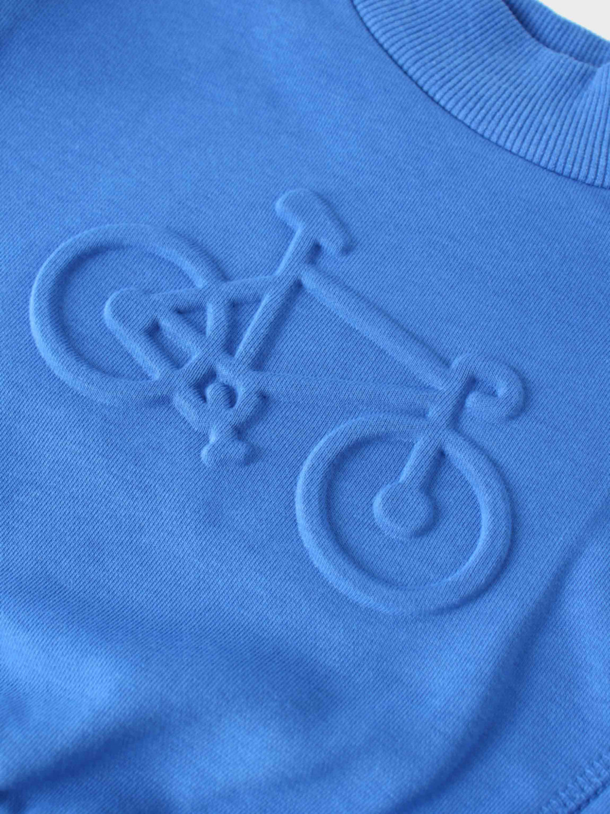 Royal blue sweatshirt with embossed bicycle motif.
