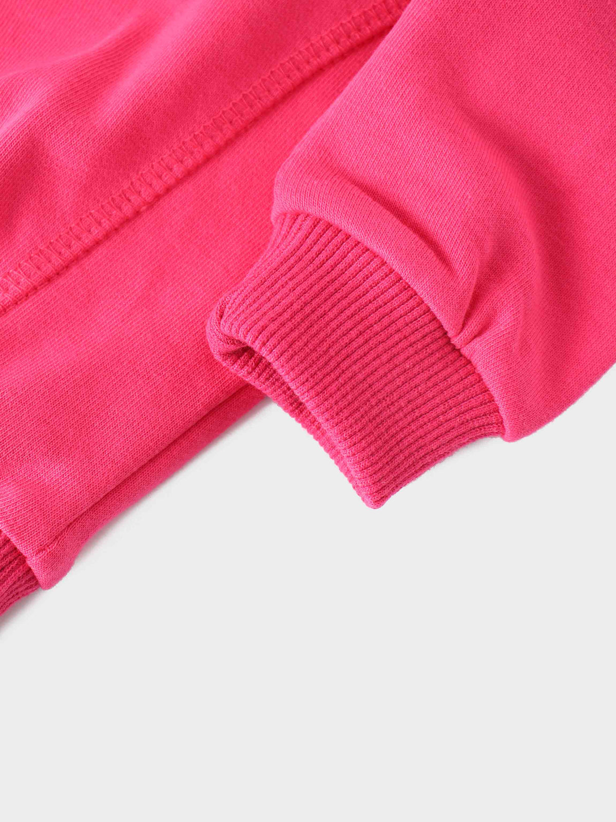 Neon pink bike sweatshirt sleeve with ribbed cuff and side seam stitching.