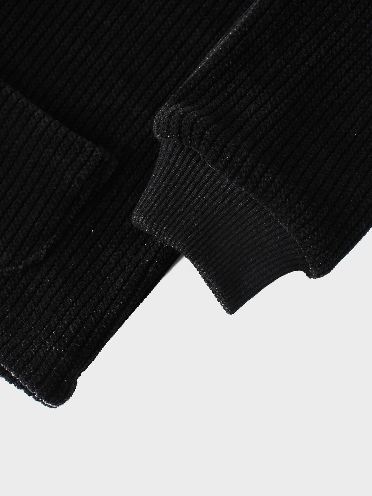 Corduroy Jacket for girls in black; close-up of sleeve with ribbed cuff.