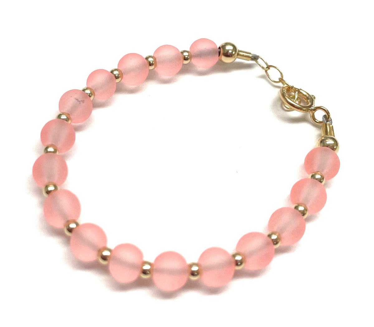Salmon bead bracelet by My Little Jewel, pink frosted glass beads with gold spacers and lobster clasp