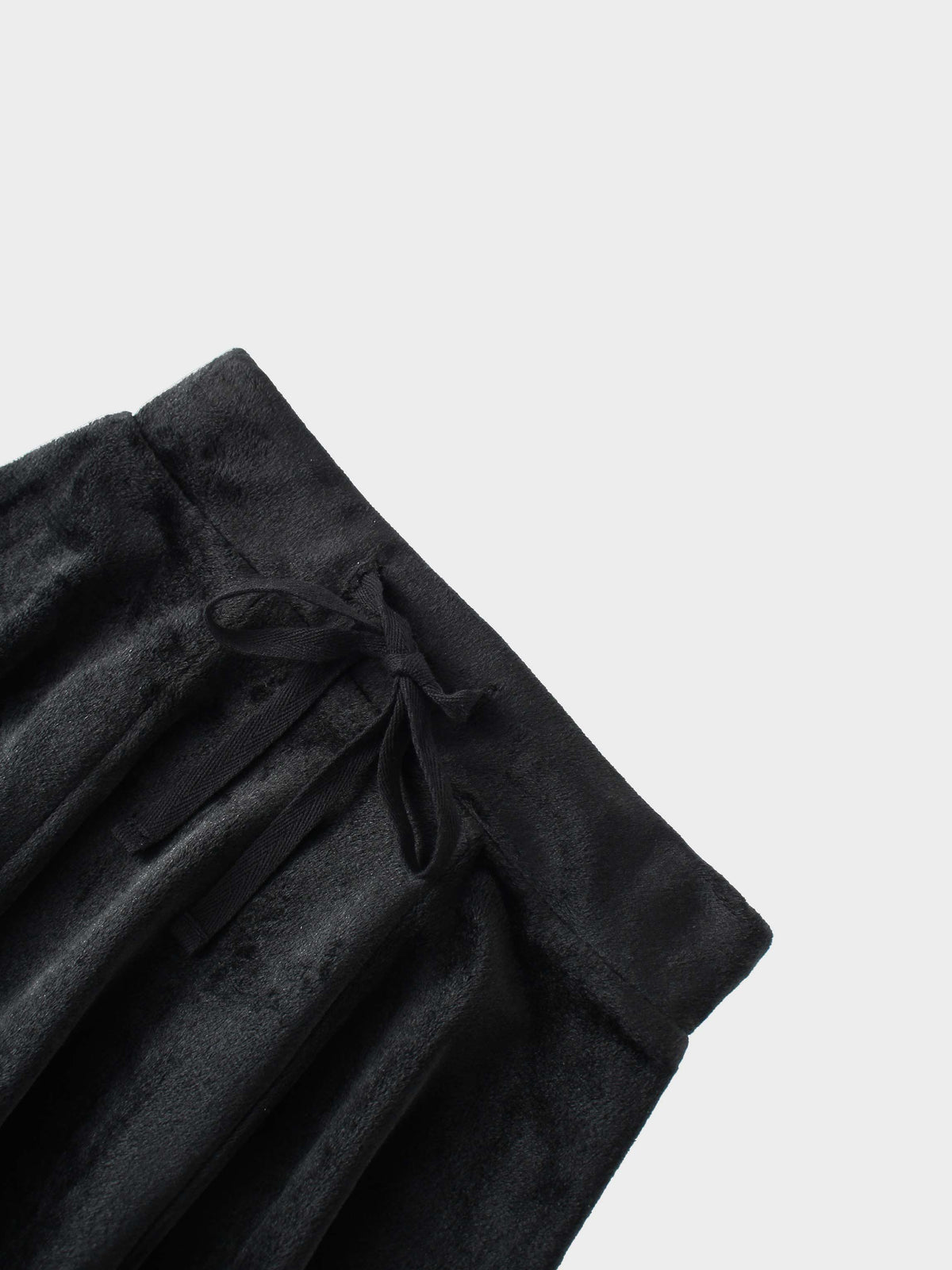 Black velour six-panel circle skirt with a waist tie.