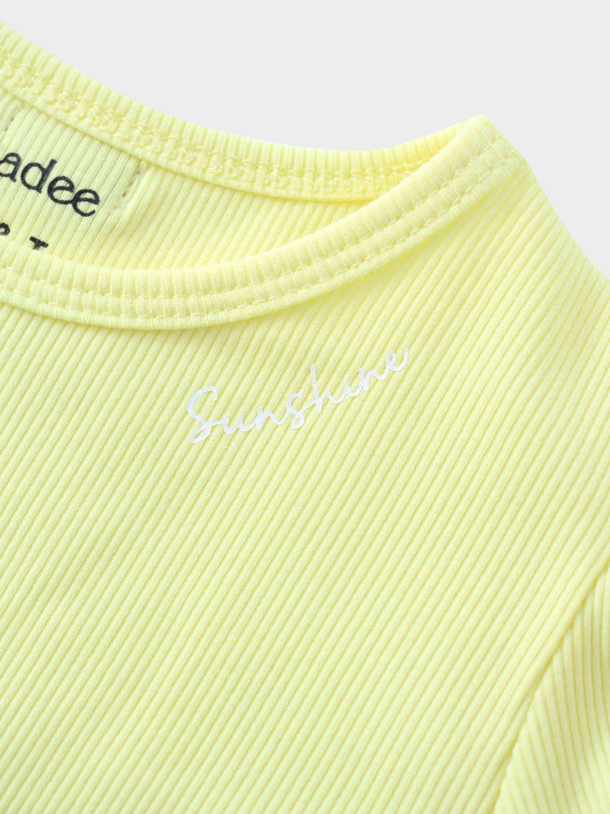 Yellow ribbed shirt with &