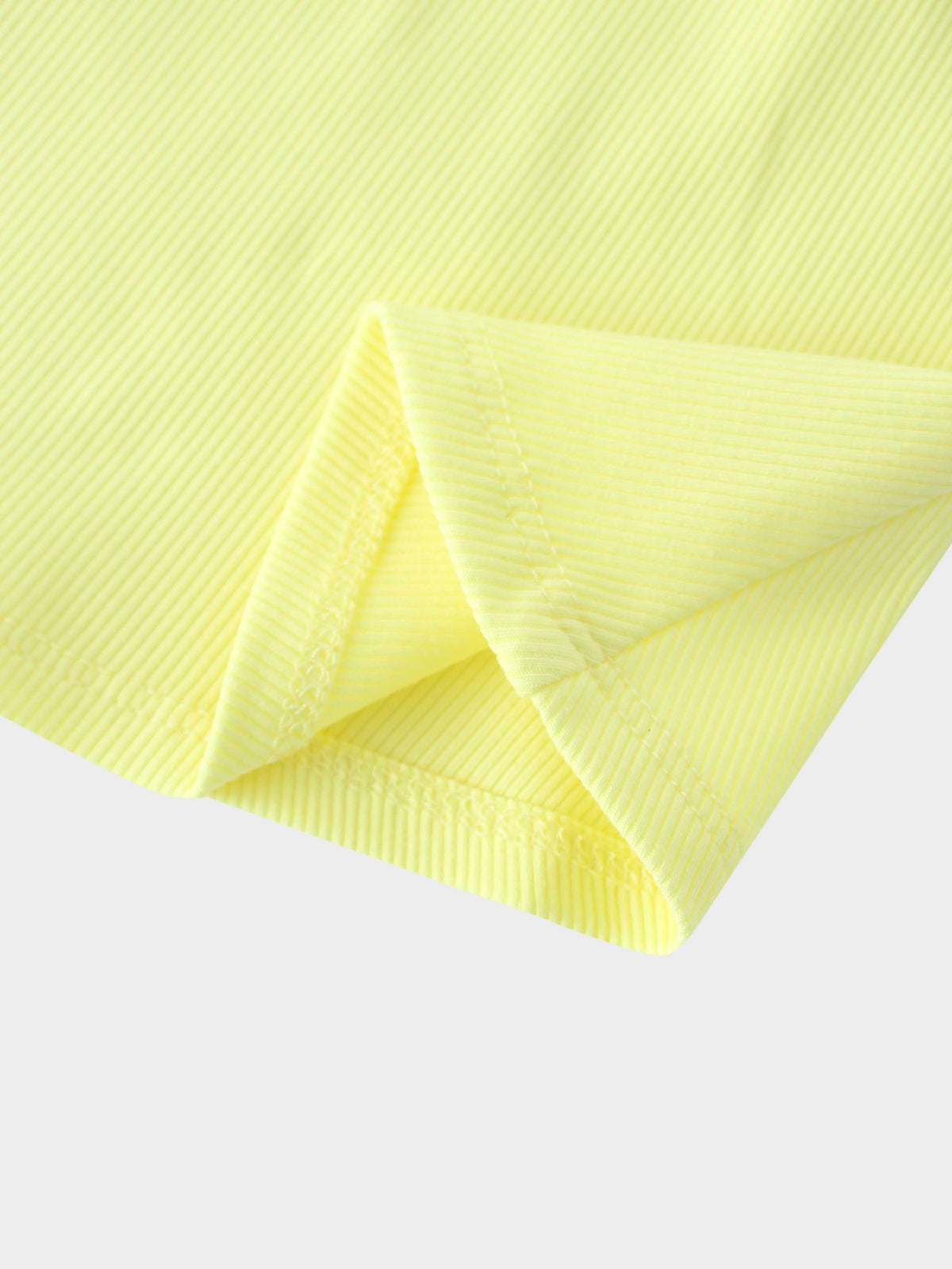 Close-up of yellow ribbed fabric, girls&