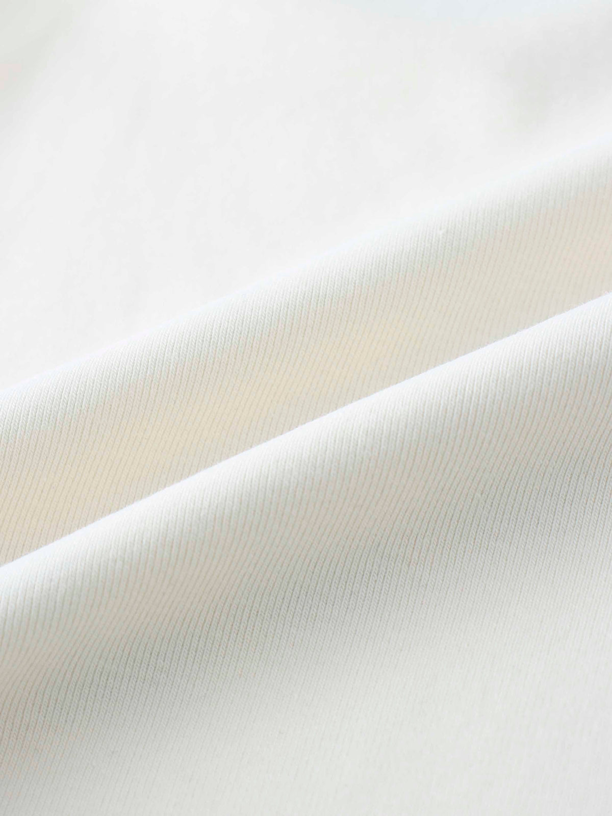 Soft ribbed off-white fabric close-up