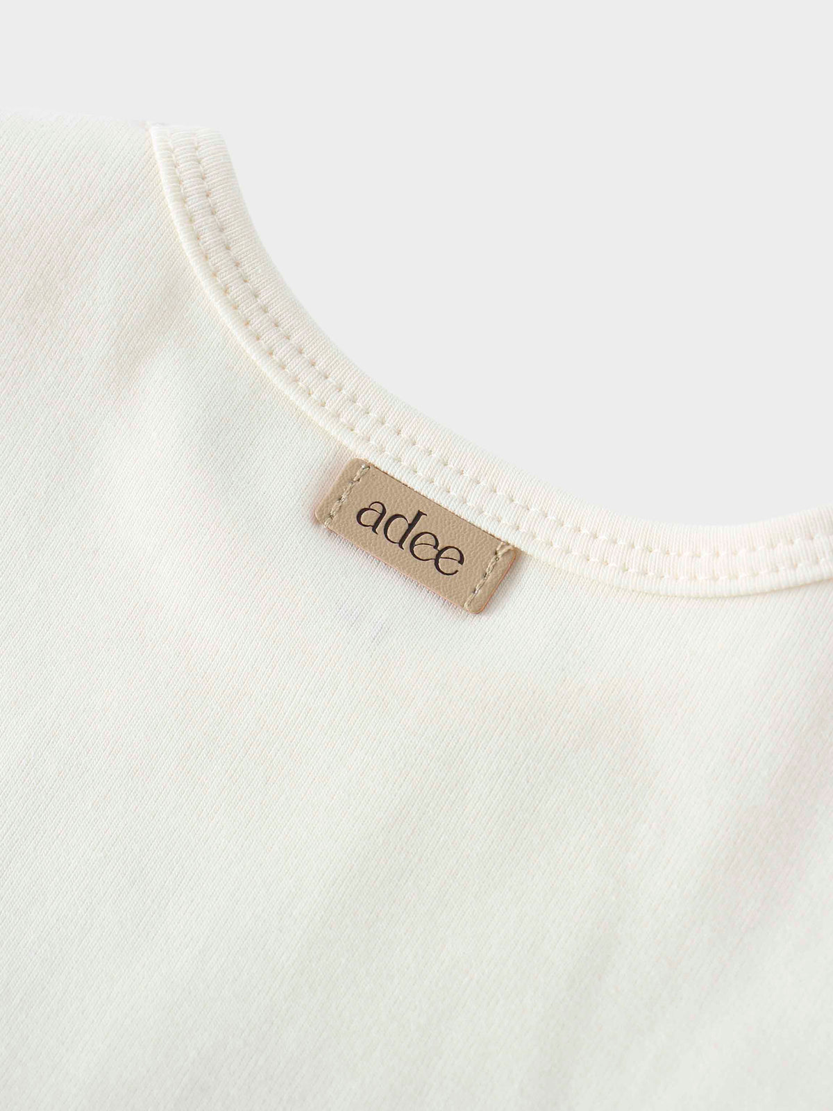 Baby tank top neckline tag