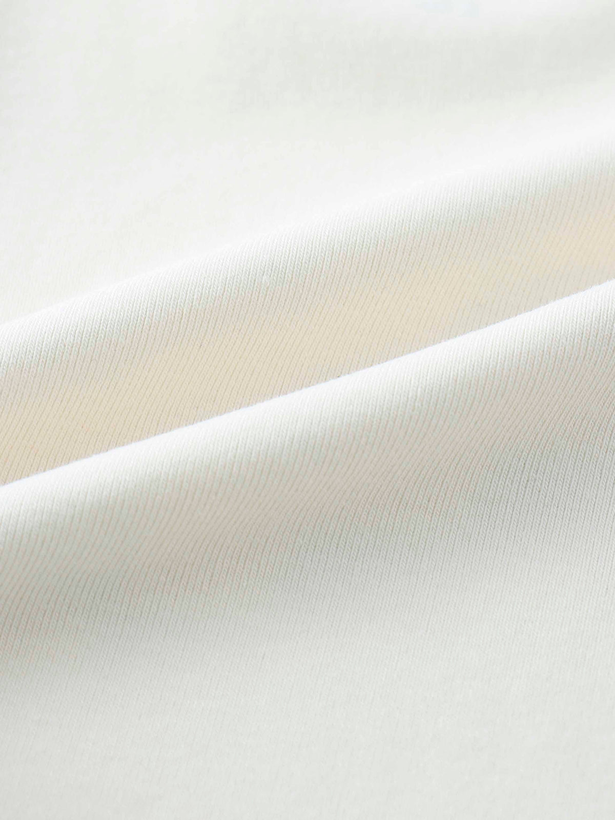 Soft ribbed off-white fabric texture.