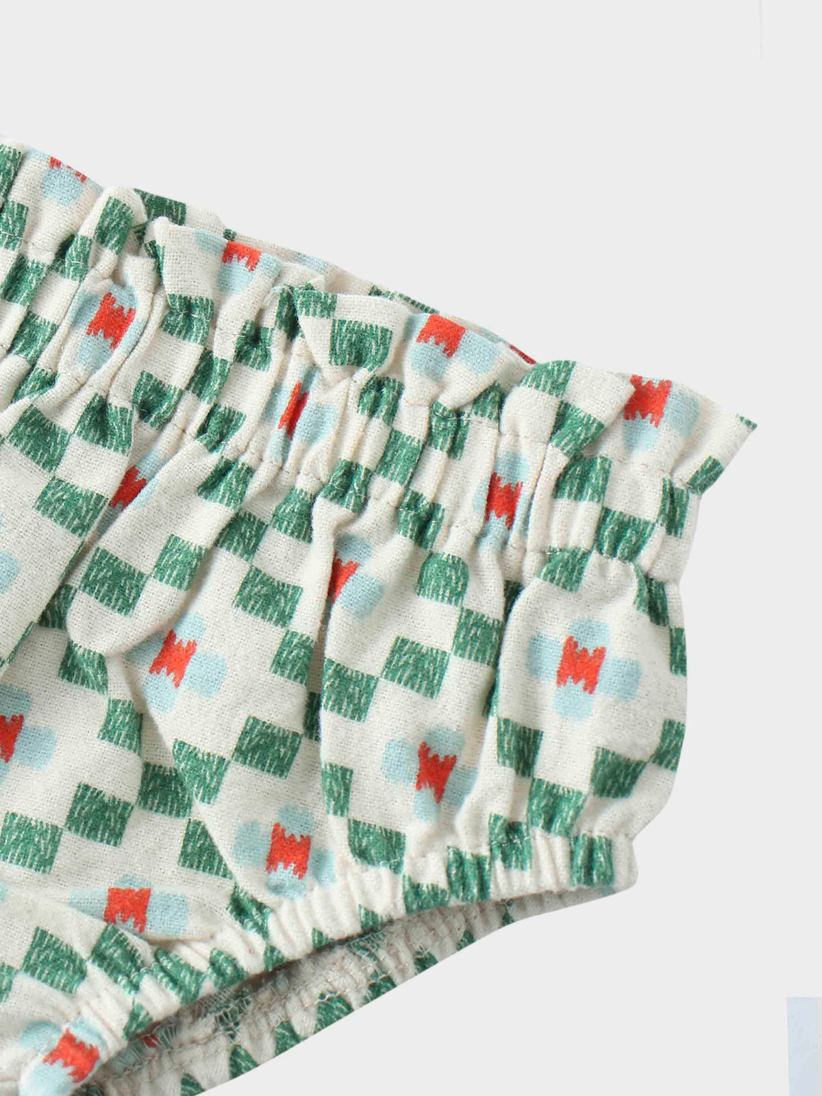 Ruffled baby bloomers with geometric pattern
