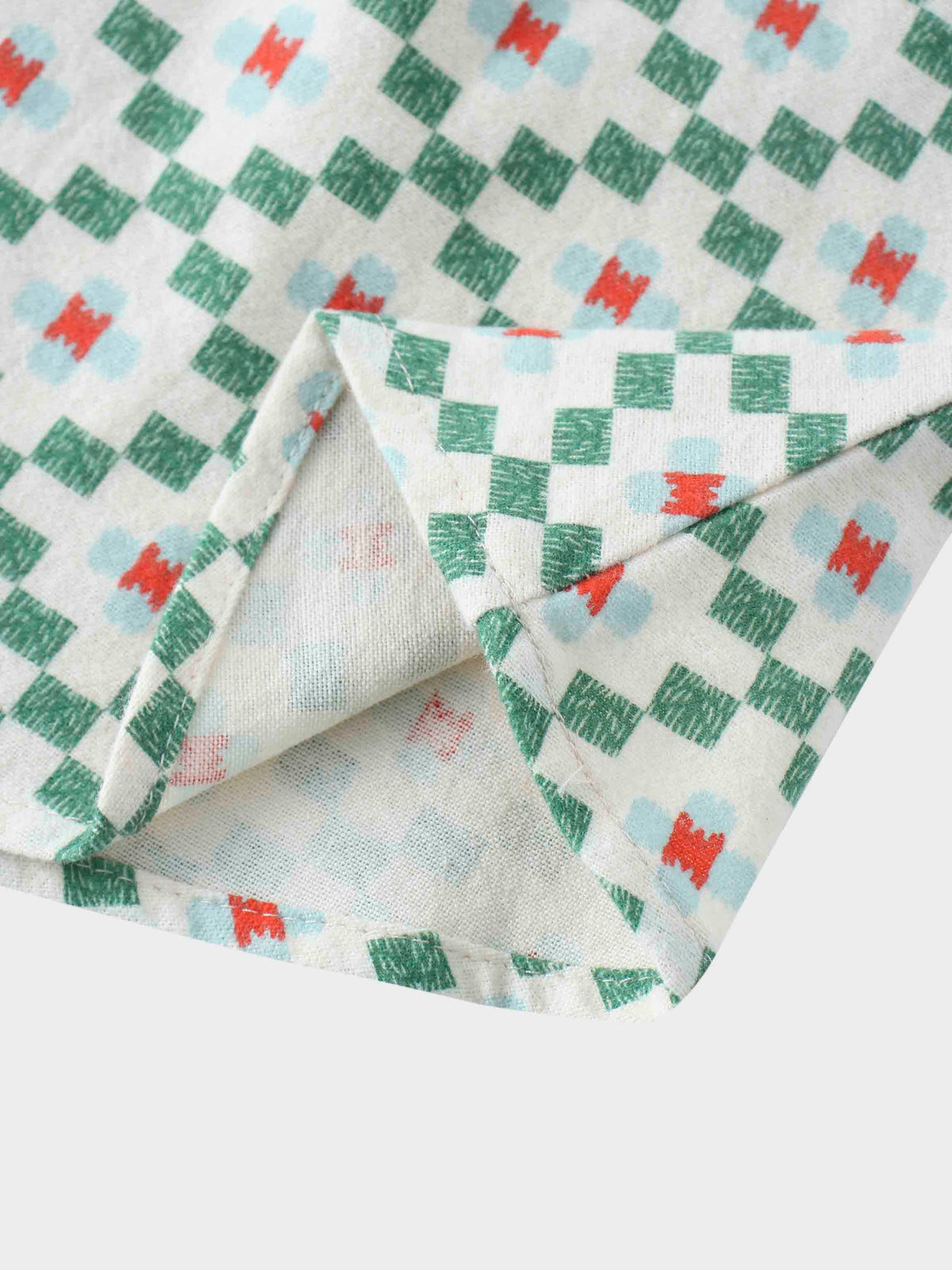 Green diamond pattern fabric close-up