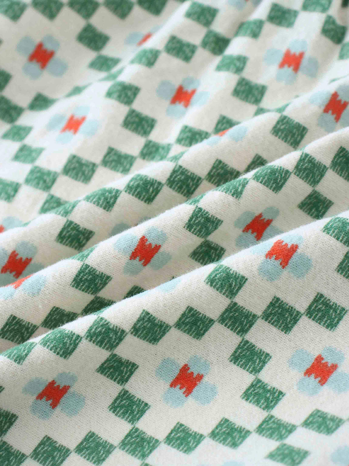 Green diamond pattern fabric close-up