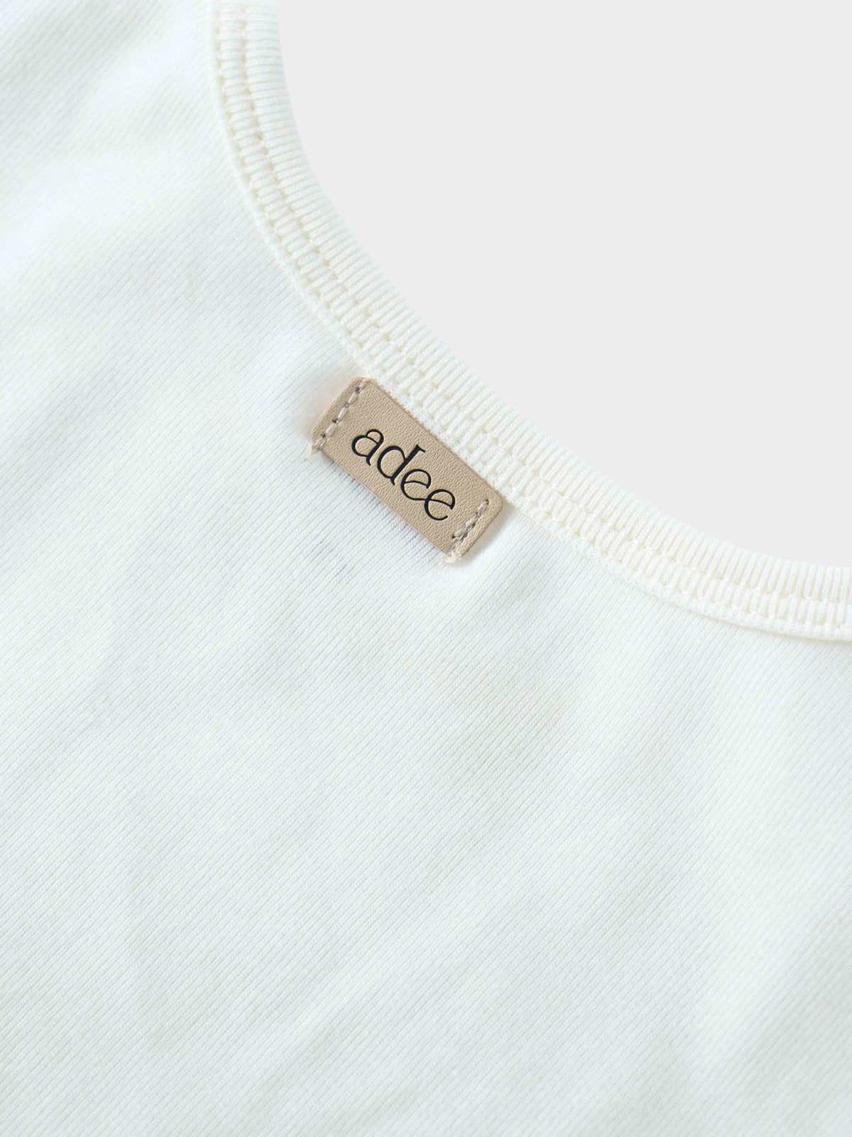 Close-up of Addee shirt label